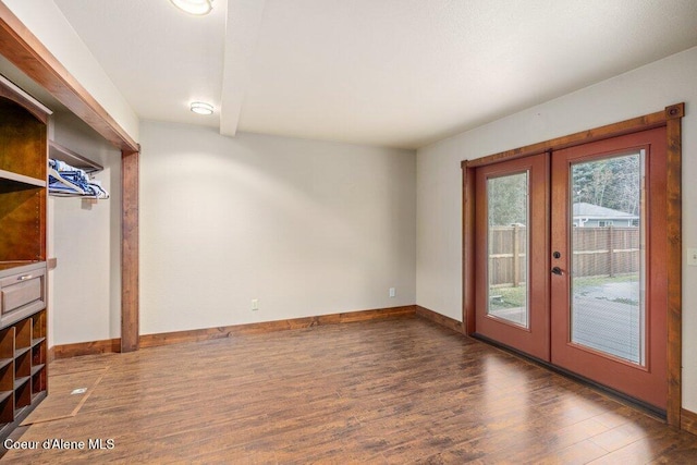 interior space featuring french doors, baseboards, and wood finished floors