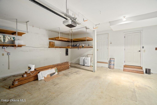 garage featuring baseboards and a garage door opener