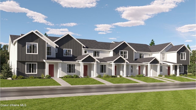 view of front of property featuring a residential view, a front lawn, and board and batten siding