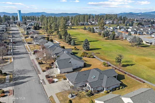 drone / aerial view featuring a residential view and a mountain view