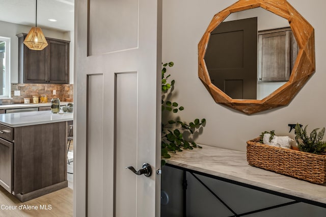 interior space featuring decorative backsplash and wood finished floors