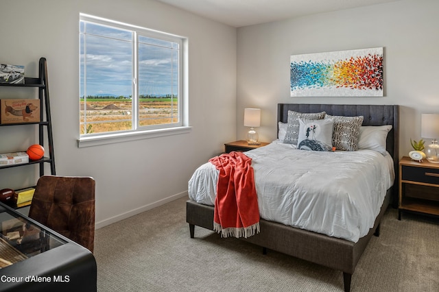 bedroom featuring carpet flooring and baseboards