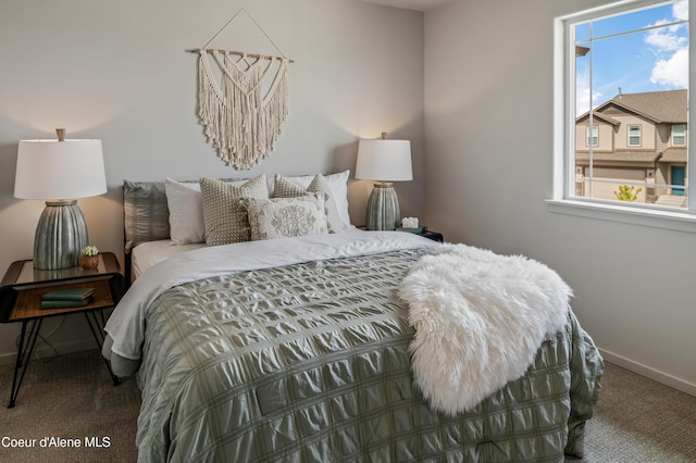 bedroom with carpet and baseboards