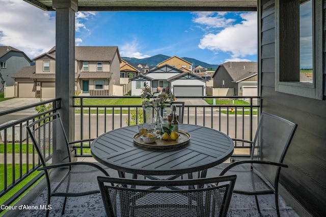 balcony with a residential view and a mountain view