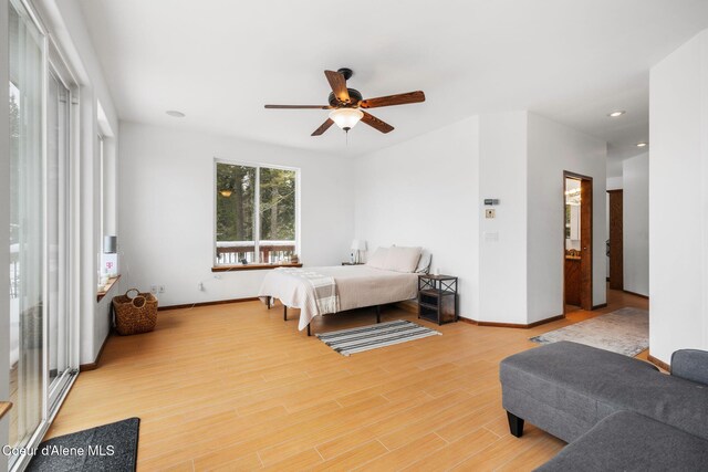 bedroom featuring a ceiling fan, baseboards, wood finished floors, and recessed lighting