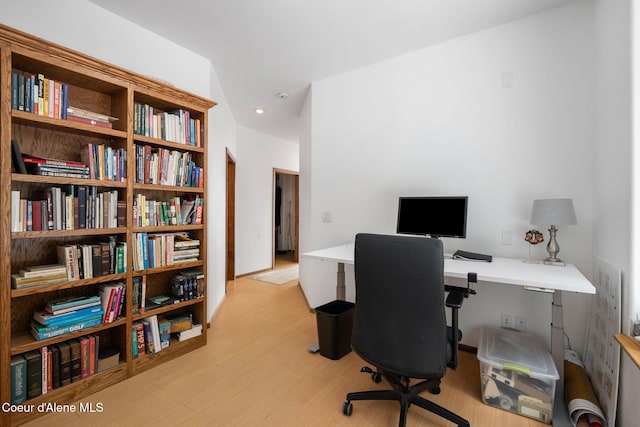 home office with wood finished floors