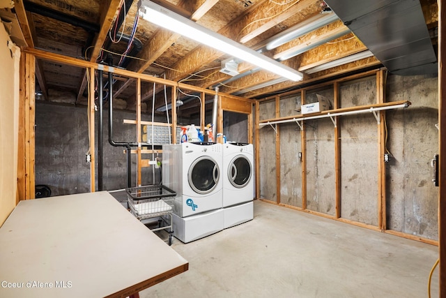 unfinished basement with washing machine and clothes dryer