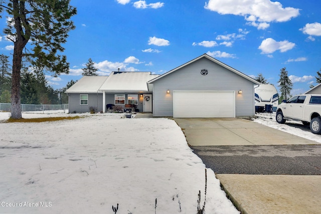 single story home featuring driveway, a garage, and fence