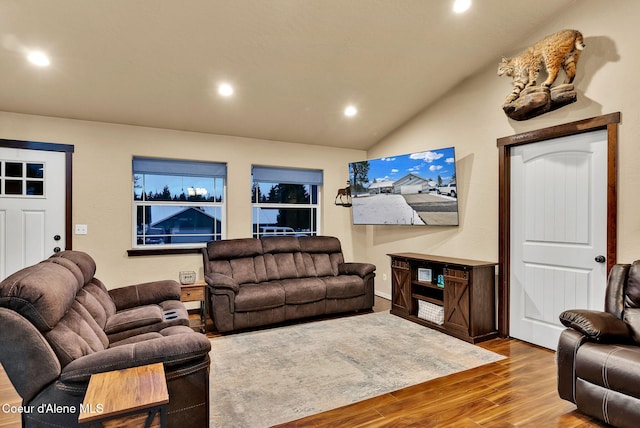 living room with vaulted ceiling, wood finished floors, and recessed lighting