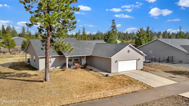 single story home featuring driveway, an attached garage, fence, and roof with shingles