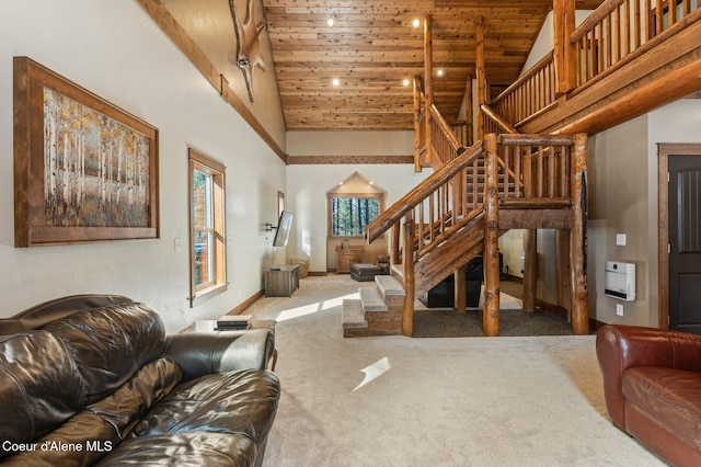 living area featuring wood ceiling, heating unit, stairs, carpet flooring, and high vaulted ceiling