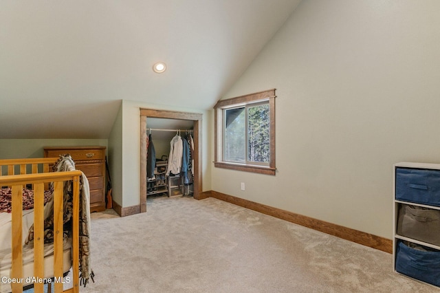 bedroom featuring recessed lighting, light colored carpet, baseboards, vaulted ceiling, and a closet