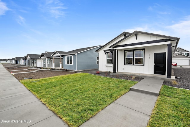 view of front of property with a front lawn and board and batten siding