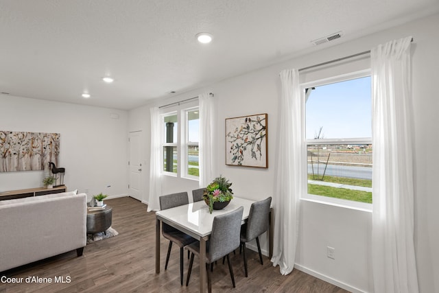 dining area featuring recessed lighting, wood finished floors, visible vents, and baseboards