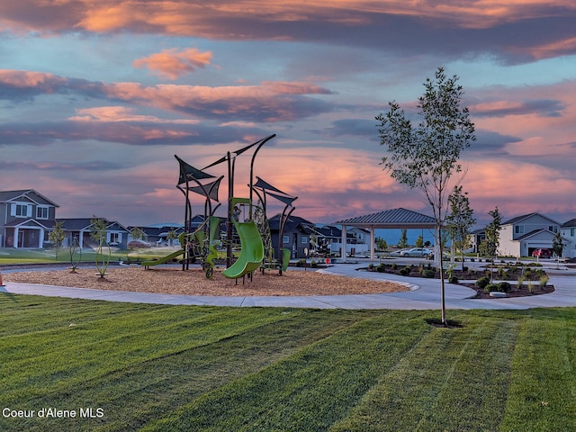 communal playground with a residential view, a lawn, and a gazebo