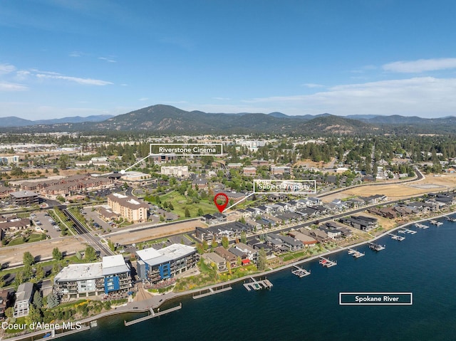 birds eye view of property featuring a water and mountain view