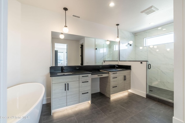 full bathroom with a freestanding tub, visible vents, vanity, and a marble finish shower