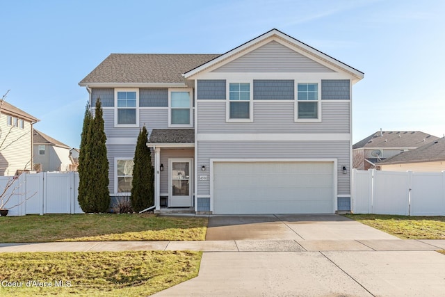 traditional home with a gate, fence, driveway, and a front lawn