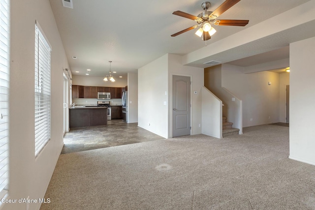 unfurnished living room with carpet floors, recessed lighting, visible vents, stairway, and ceiling fan