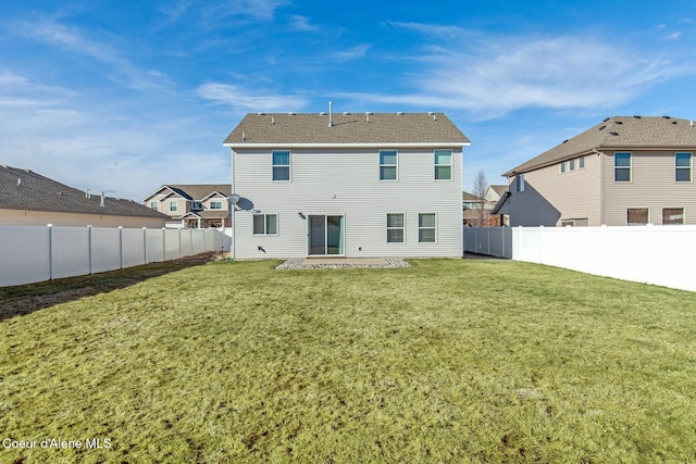 back of house with a patio area, a fenced backyard, and a lawn