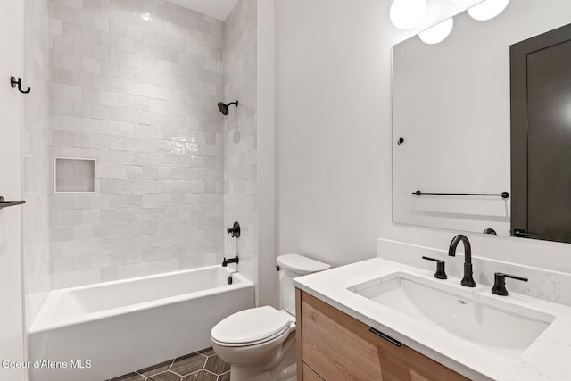 bathroom with toilet, tile patterned floors, washtub / shower combination, and vanity