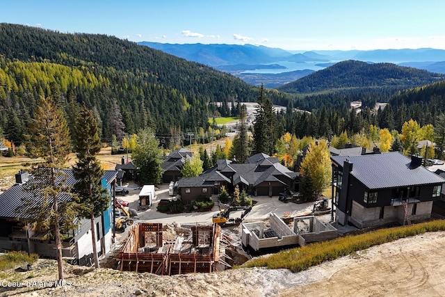 aerial view with a mountain view and a wooded view