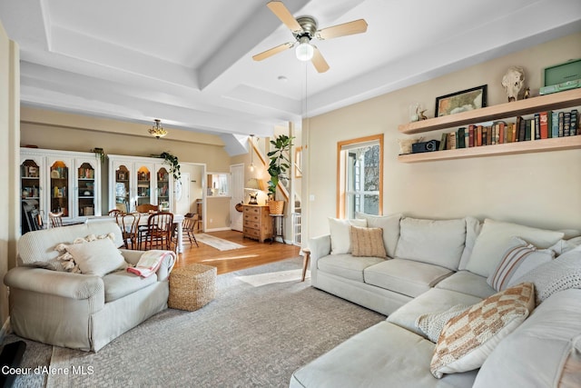 living area featuring wood finished floors and a ceiling fan