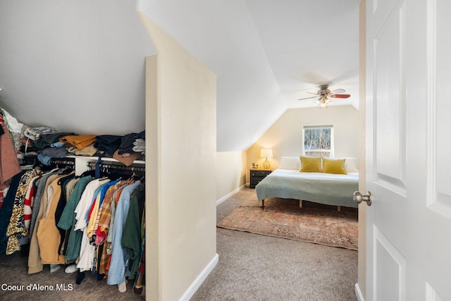 bedroom featuring lofted ceiling, carpet floors, a ceiling fan, and baseboards