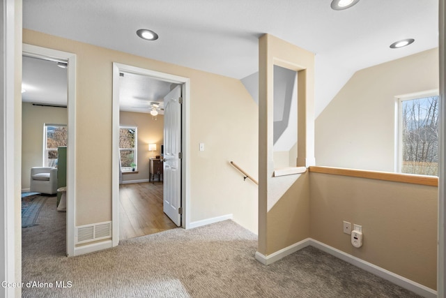 spare room featuring carpet floors, recessed lighting, and baseboards