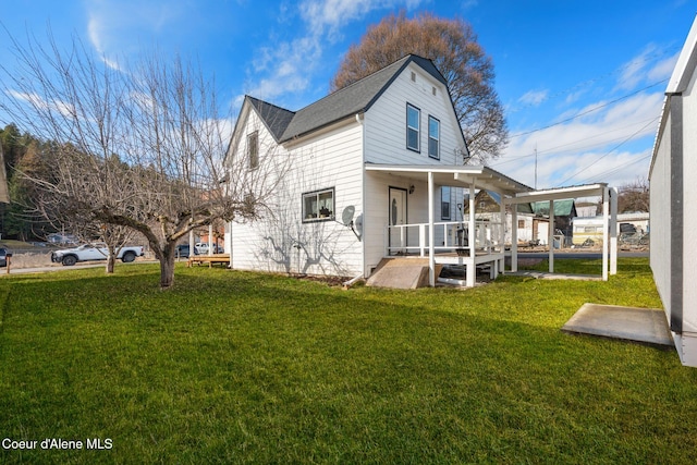 exterior space with a porch and a lawn