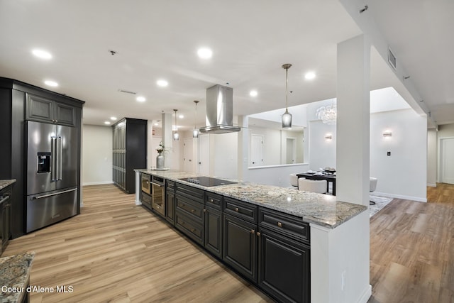 kitchen with island exhaust hood, light wood finished floors, black electric stovetop, high end fridge, and dark cabinetry