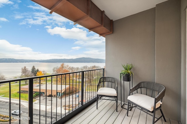 balcony featuring a water view