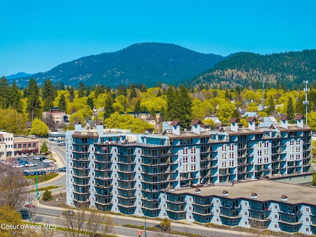 301 N 1st St # 930, Coeur Dalene, ID 83814 - drone / aerial view with a mountain view and a wooded view