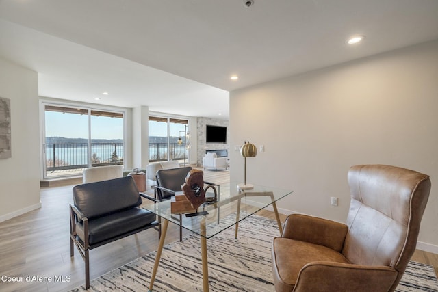 301 N 1st St # 930, Coeur Dalene, ID 83814 - living room with baseboards, recessed lighting, and light wood-style flooring