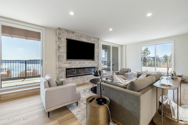 301 N 1st St # 930, Coeur Dalene, ID 83814 - living room with recessed lighting, wood finished floors, and a fireplace