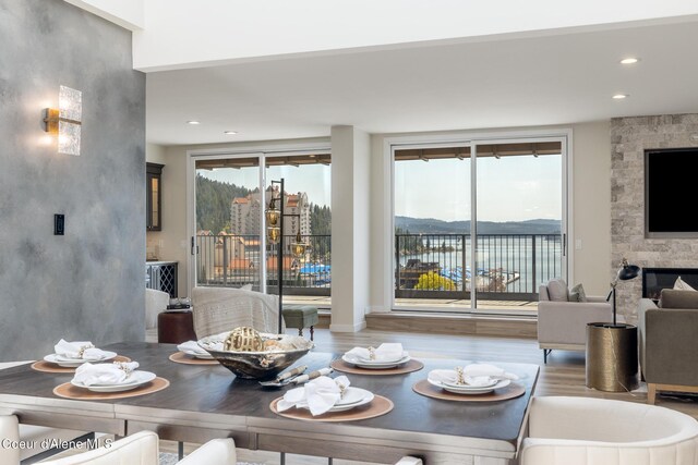 301 N 1st St # 930, Coeur Dalene, ID 83814 - dining area featuring a fireplace, recessed lighting, and wood finished floors