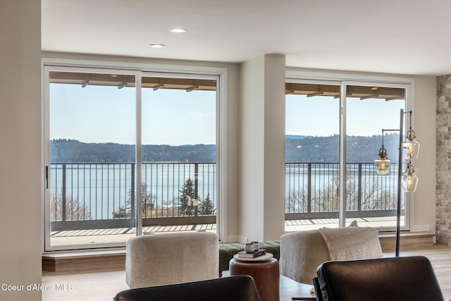301 N 1st St # 930, Coeur Dalene, ID 83814 - living area featuring a water view and wood finished floors