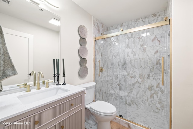301 N 1st St # 930, Coeur Dalene, ID 83814 - full bath with toilet, visible vents, a marble finish shower, and vanity