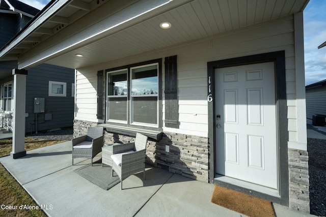 view of exterior entry featuring stone siding