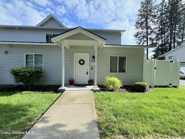 723 E Whispering Pines Ln # 17, Coeur Dalene, ID 83815 - view of front facade with a front yard