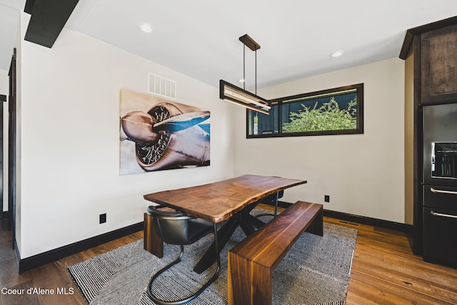 dining area with recessed lighting, visible vents, baseboards, and wood finished floors