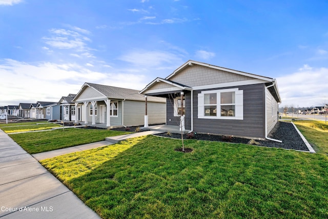 view of front of property with a front yard and covered porch