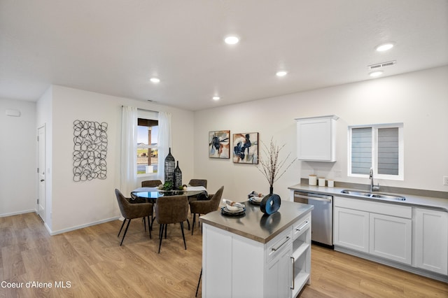 kitchen with recessed lighting, visible vents, a sink, light wood-type flooring, and dishwasher