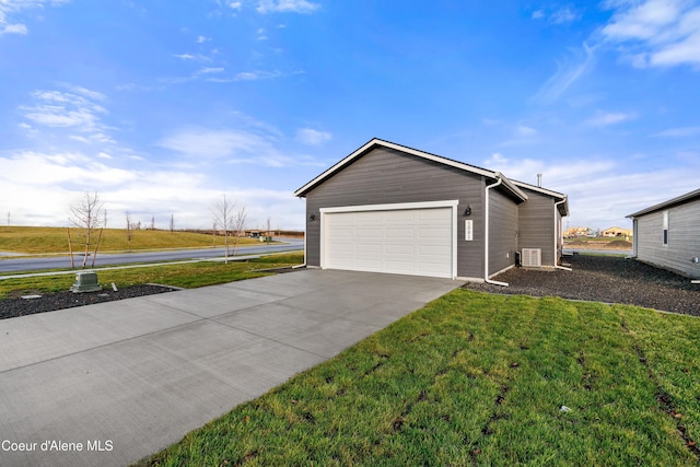 view of property exterior with an attached garage, concrete driveway, and a yard