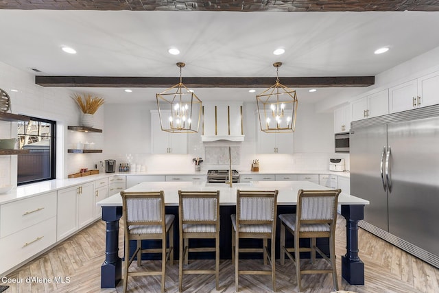 1853 W Felton Dr, Coeur Dalene, ID 83814 - kitchen with beamed ceiling, open shelves, light countertops, and built in appliances