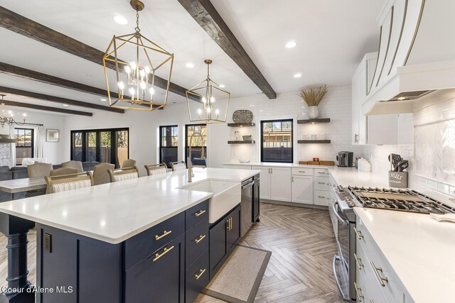 1853 W Felton Dr, Coeur Dalene, ID 83814 - kitchen with appliances with stainless steel finishes, backsplash, a sink, and white cabinetry