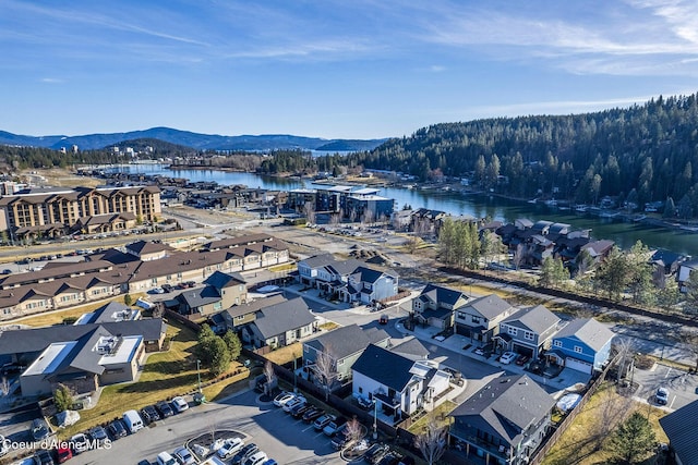 birds eye view of property with a residential view and a water and mountain view