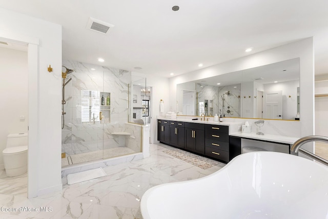 1853 W Felton Dr, Coeur Dalene, ID 83814 - full bathroom with marble finish floor, a freestanding tub, a marble finish shower, and visible vents