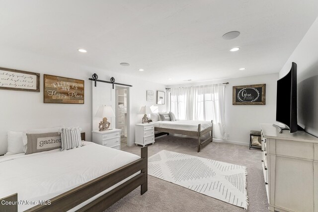 1853 W Felton Dr, Coeur Dalene, ID 83814 - bedroom with recessed lighting, a barn door, baseboards, and light colored carpet