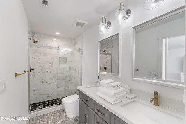 1853 W Felton Dr, Coeur Dalene, ID 83814 - bathroom featuring toilet, vanity, a marble finish shower, and visible vents